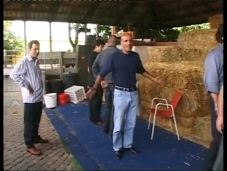 A group of men have rough sex with a blonde woman in a barn porn video